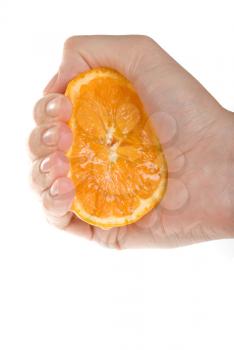 Royalty Free Photo of a Hand Squeezing an Orange 