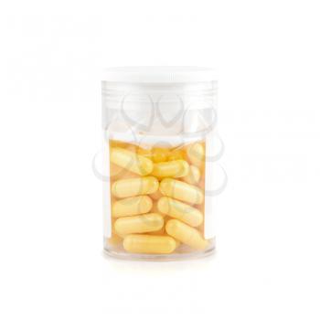 yellow pills isolated on a white background
