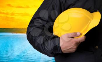 Royalty Free Photo of a Builder in Front of a Lake