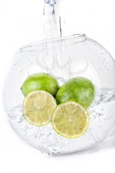 Royalty Free Photo of Limes in Water