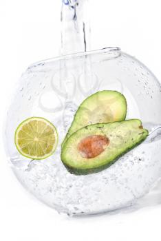 Royalty Free Photo of a Lime and Avocado in Water