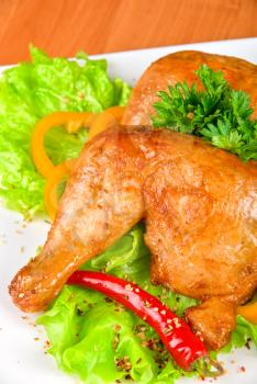 Royalty Free Photo of Roasted Chicken Garnished With Fresh Peppers