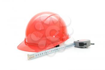 Red Safety helmet and measuring tape isolated on white