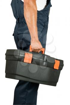 Royalty Free Photo of a Repairman Holding a Toolkit 