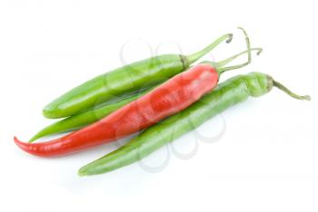 red and green hot chili peppers isolated on white