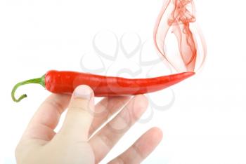 Royalty Free Photo of Someone Holding a Chili Pepper