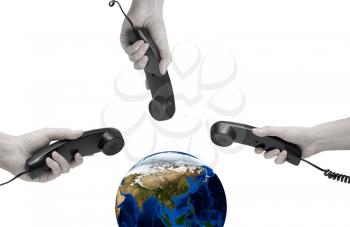 Royalty Free Photo of Hands Holding Phone Receivers Near a Globe