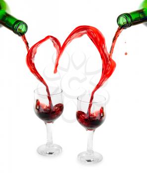 Royalty Free Photo of Red Wine Being Poured into Glasses