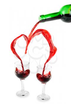 Royalty Free Photo of Red Wine Being Poured into Glasses