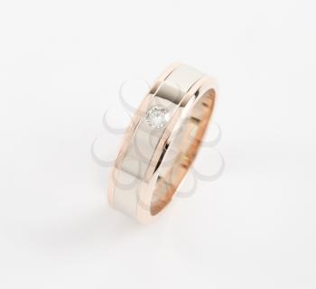 gold ring with gem on a white