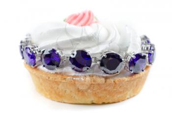 cupcake and bijouterie bracelet with blue gems on a white background