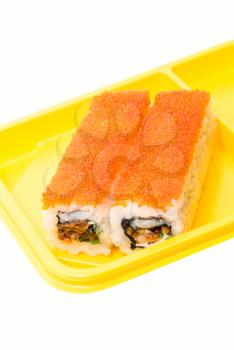 Yellow plate with rolls of sushi on white background