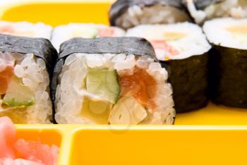 Close up of sushi  on yellow plate