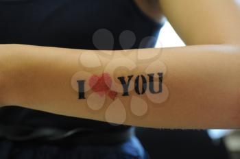 closeup of tatoo I love you at woman hand