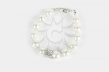 Pearl bracelet on white background