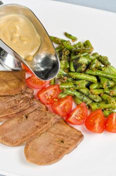 grilled beef tongue with green beans and tomato cherry