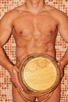 Closeup of beautiful muscular man at sauna