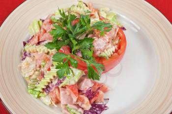 Tuna salad with different vegetables on plate