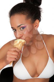 Portrait of sexy young beautiful woman eating sweet ice-cream on a white