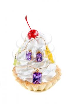 cupcake and bijouterie earrings and pendant on a white background