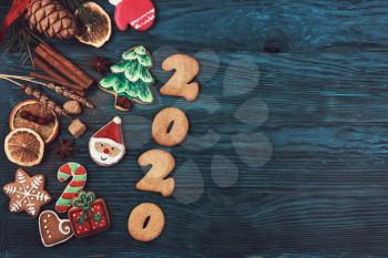Gingerbreads for new 2020year on wooden background, xmas theme
