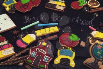 Back to school gingerbreads cookies on a dark background