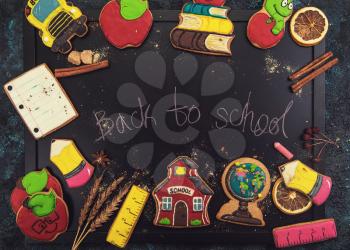 Back to school gingerbreads cookies on a dark background