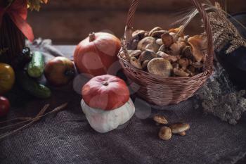 Still life from autumn nature gifts. mushrooms and vegetables