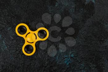 Yellow spinner on a dark background
