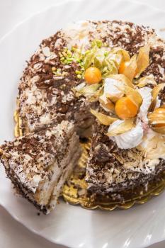 Chocolate cake with walnuts and physalis