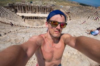 Selfie photo in amphitheatre in the ruins of Hierapolis, in Pamukkale, Turkey.