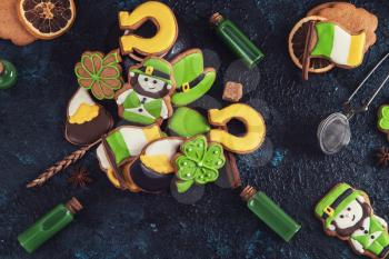 Gingerbreads for Patrick's day and on wooden background