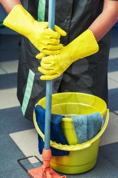 Cleaning concept. Closeup photo of woman cleaning shopping mall