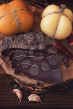 Beef jerky on wooden background