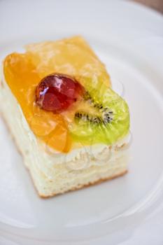Colorful fruit supcake made with kiwi, grape and orange