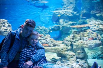 Photo of man with son in the oceanarium