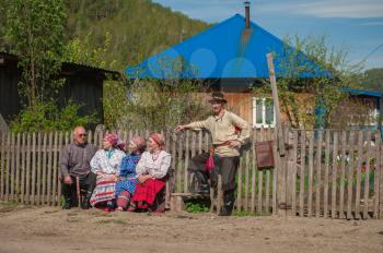 TOPOLNOE, ALTAY, RUSSIA - May 27, 2018: Folk festivities dedicated to the feast of the Holy Trinity. Villagers in traditional costumes are waiting for the beginning of the festival.
