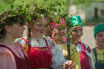 TOPOLNOE, ALTAY, RUSSIA - May 27, 2018: Folk festivities dedicated to the feast of the Holy Trinity. Happy young girls in traditional dress