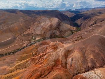 Aerial drone view of colorful eroded landform of Altai mountains in popular tourist location called Mars, Chagan-Uzun, Altai Republic, Russia