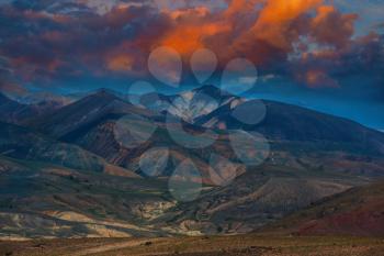 Different colored mountains with beauty sunset sky in Mongolian Altai mountains