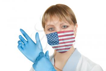 Closeup of a female healthcare professional nurse wearing a protection mask with USA flag
