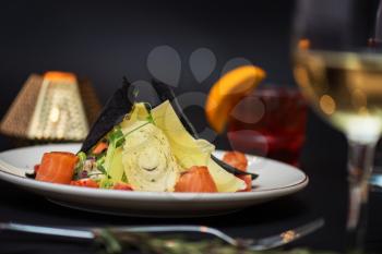 Caesar salad with salmon fish. Tasty restaurant dish