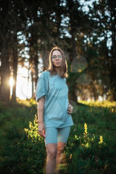 Healthy lifestyle woman walking in mountains in summer forest area