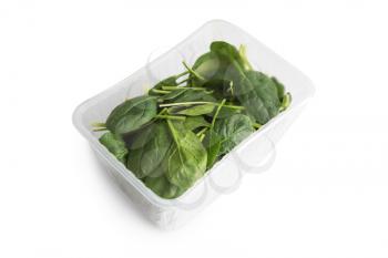 Basil in plastic bag isolated on a white background