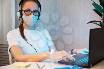 Woman doctor working in rotective mask and sanitizer spray on the working place