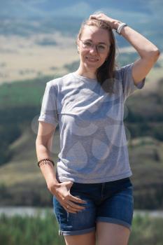 Travel, leisure and freedom concept - woman portrait in Altai mountains, beauty summer day