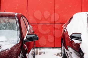 Car on parking with red bright color, winter day