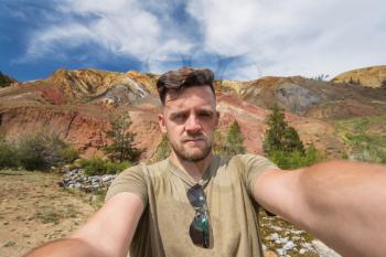 Selfie of man in Valley of Mars landscapes in the Altai Mountains, Kyzyl Chin, Siberia, Russia
