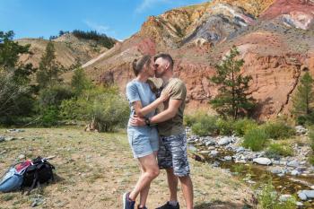 Kissing of family in mountain, man and woman, beauty summer landcape