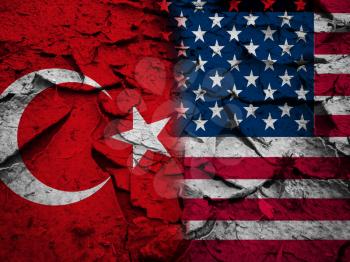 Sanction or conflict concept, USA flag against Turkey flag, on dry cracked earth background
